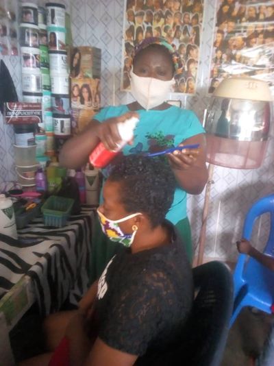 Akua with a client in her salon