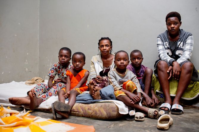 Therese sits surrounded by her children at Nakivale Refugee Camps